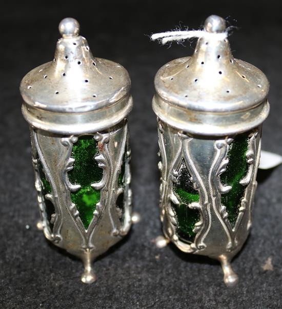 Pair of Art Nouveau silver peppers, pierced with sinuous leaves, green glass liners, William Henry Sparrow, Birmingham 1906